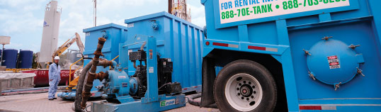 E-Tank rental equipment and frac tanks set up on industrial job site for wastewater management and environmental containment