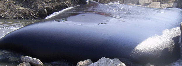E-Tank geotextile dewatering bag in use for sludge dewatering and sediment filtration in environmental water treatment projects