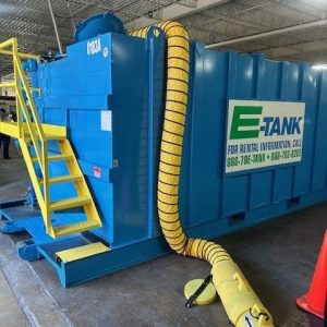 E-Tank rental frac tank with yellow ventilation hose set up indoors for confined space training and safety preparation