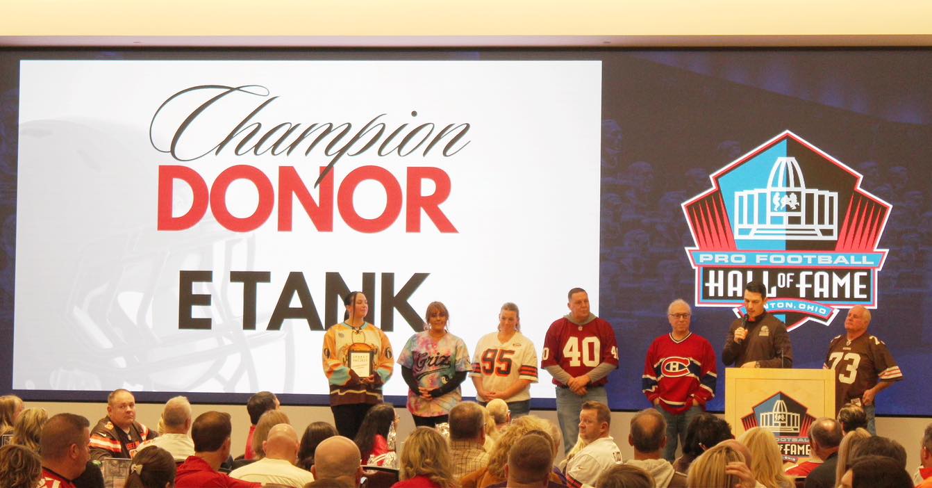 E-Tank recognized as Champion Donor at Pro Football Hall of Fame event in Canton, Ohio, showcasing community support and corporate giving