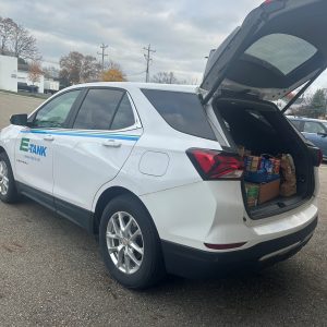 E-Tank branded vehicle loaded with food donations for local food pantry community support initiatives