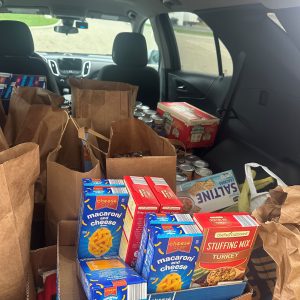 Boxes and bags of non-perishable food donations from E-Tank supporting local food pantry and community assistance programs