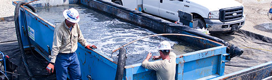 Industries served by E-Tank: construction jobsite water containment and fluid management in an open-top tank.
