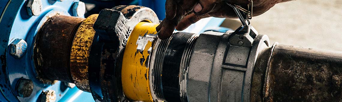 Manufacturing equipment rentals supported by on-site technicians installing and connecting industrial piping and fluid handling systems.