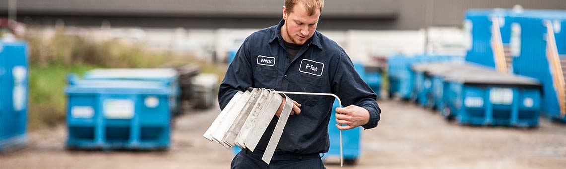 On-site fluid system support provided by E-Tank technicians performing equipment inspection, maintenance, and readiness checks.