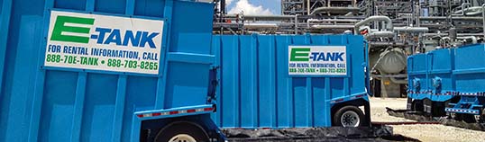 Industries served by E-Tank: waste management containment and fluid handling equipment staged at an industrial site.