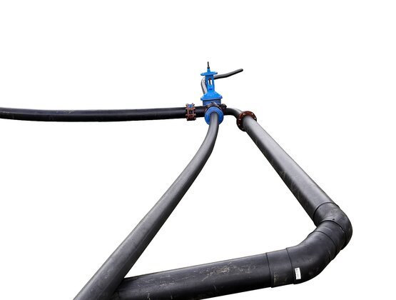 HDPE pipe system with fused joints and industrial valve used for secure fluid transfer in temporary water management setups
